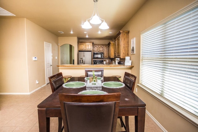 dining area featuring light tile patterned floors