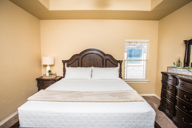 bedroom featuring dark carpet