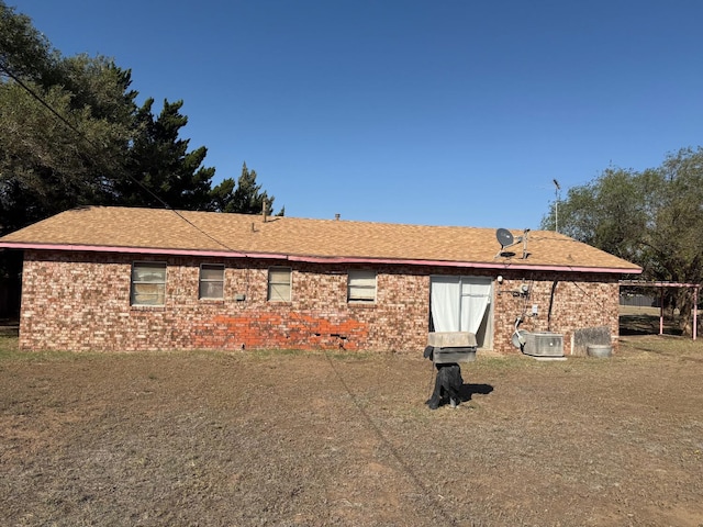 back of property featuring cooling unit