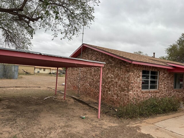 view of home's exterior featuring a carport