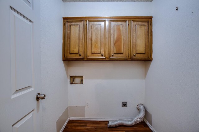 laundry area with washer hookup, cabinets, wood-type flooring, and hookup for an electric dryer