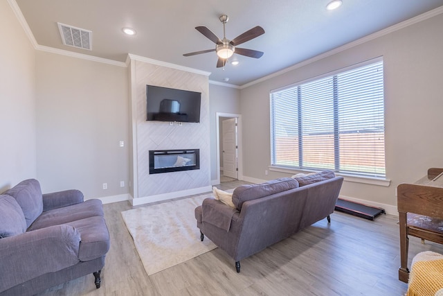 living room featuring visible vents, baseboards, and a fireplace