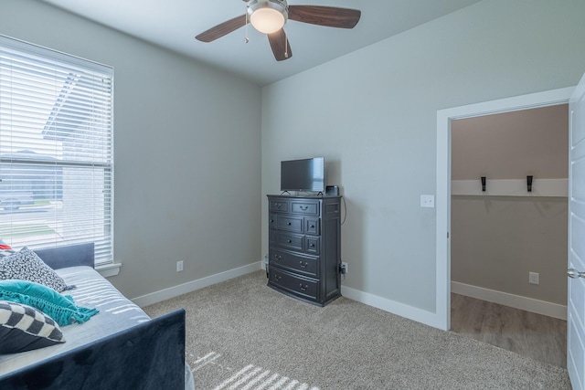 bedroom with baseboards, carpet, and a ceiling fan