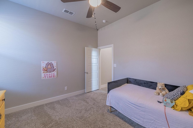 carpeted bedroom with visible vents, ceiling fan, and baseboards