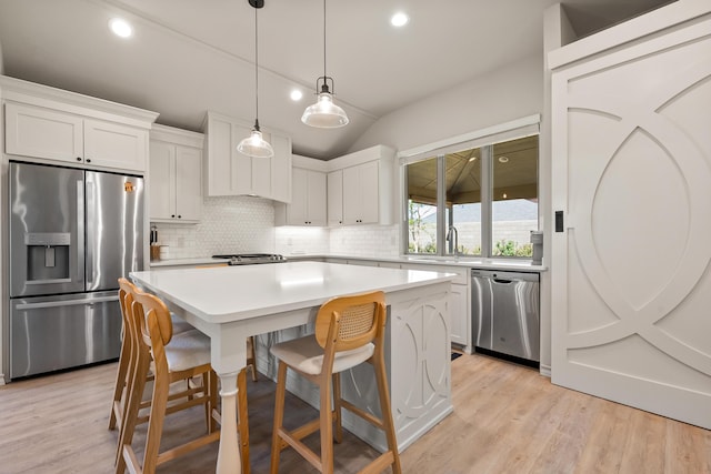 3442 126th St, Lubbock, TX 79423 - kitchen featuring a center island, stainless steel appliances, tasteful backsplash, and a sink