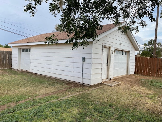 garage with a yard