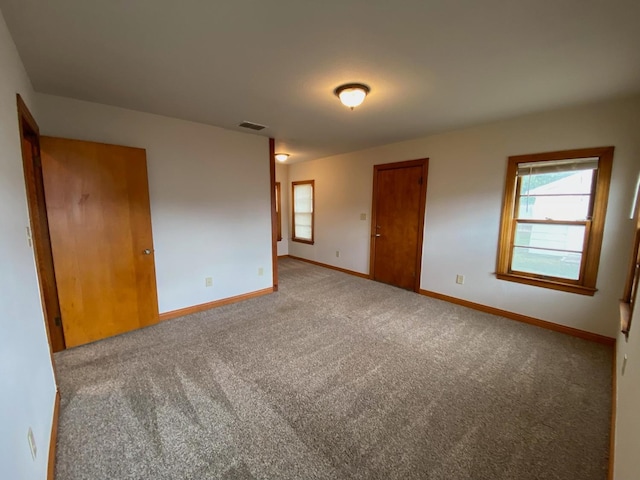 unfurnished bedroom with light carpet