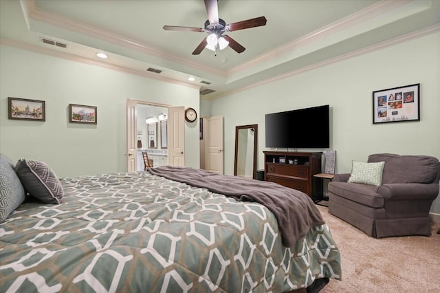 carpeted bedroom with crown molding, ceiling fan, and a tray ceiling