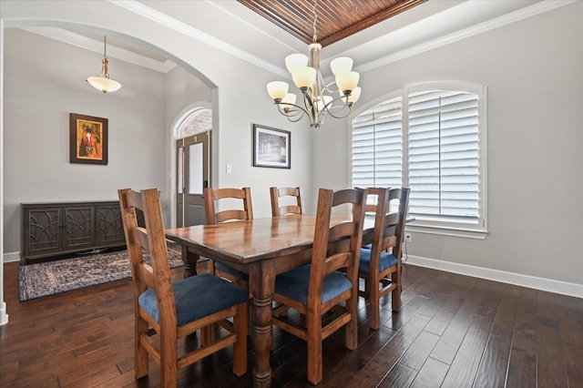 dining room with crown molding, an inviting chandelier, wooden ceiling, a tray ceiling, and dark hardwood / wood-style floors