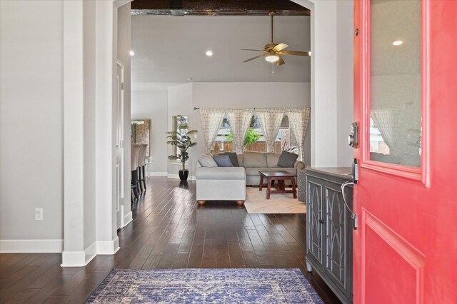 foyer featuring dark wood-type flooring and ceiling fan