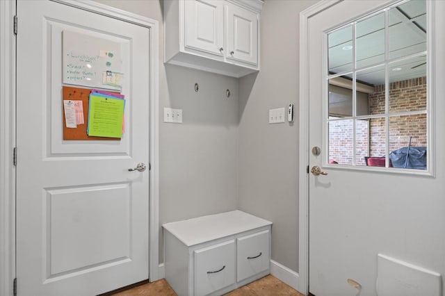 mudroom with light tile patterned flooring