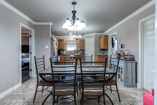 dining area featuring a chandelier, ornamental molding, baseboards, and light tile patterned floors