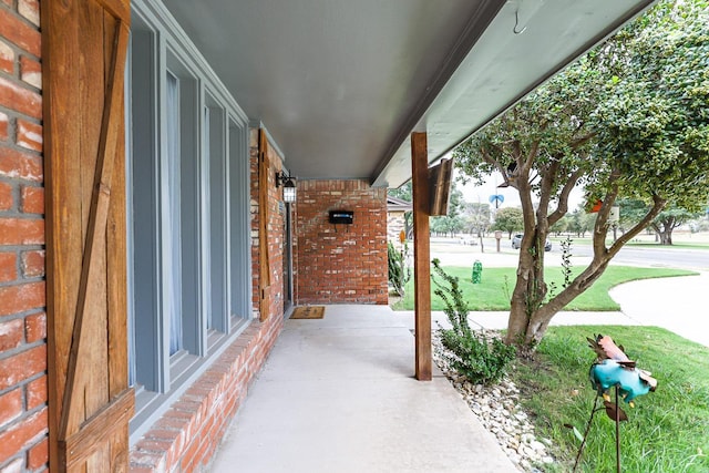 view of patio featuring a porch