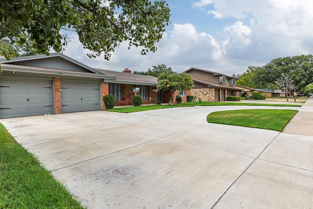 view of front of house featuring a garage and a front yard