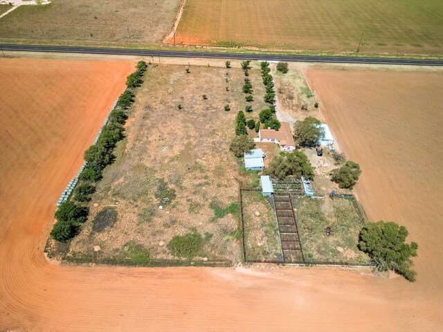 drone / aerial view featuring a water view and a rural view