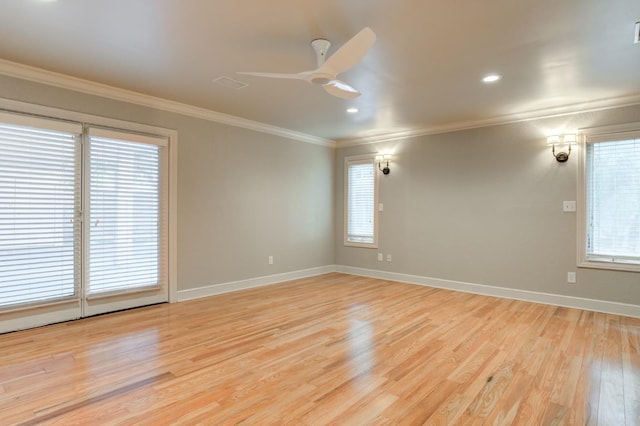 empty room with ceiling fan, ornamental molding, and light hardwood / wood-style floors