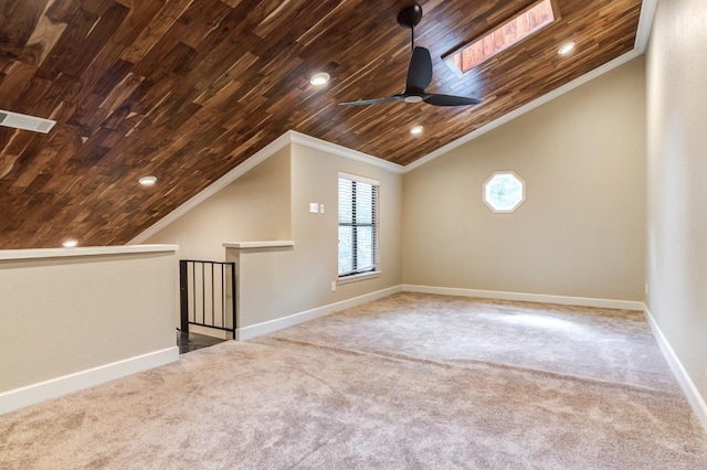 additional living space featuring wood ceiling, ceiling fan, vaulted ceiling, and carpet