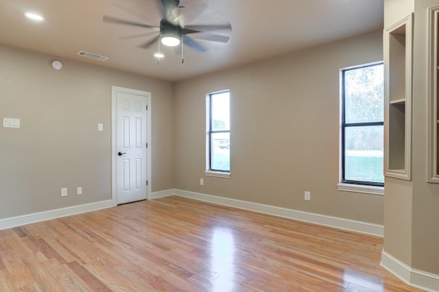 unfurnished room featuring light hardwood / wood-style flooring and ceiling fan