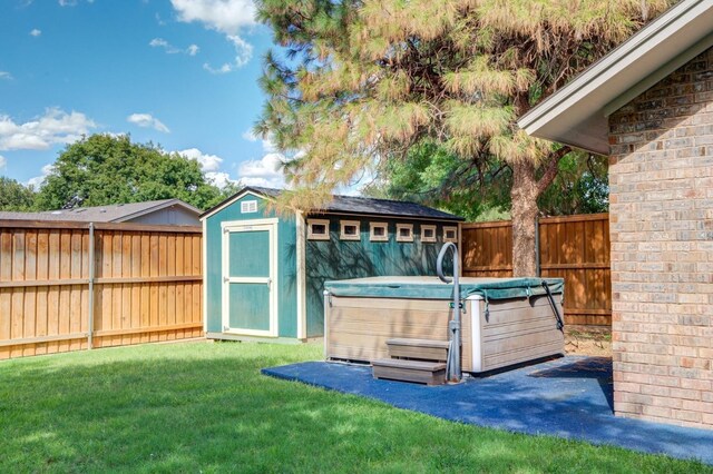 exterior space featuring a hot tub and a shed