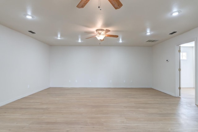 empty room with light hardwood / wood-style flooring and ceiling fan