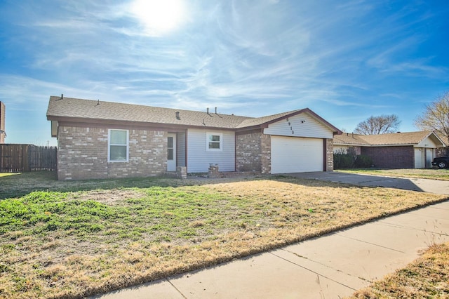 ranch-style home with a garage and a front yard