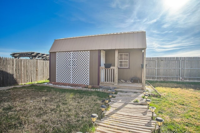 view of outbuilding with a yard