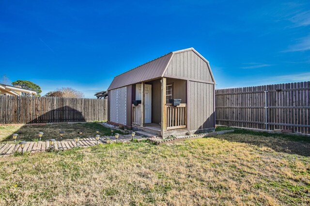 view of outbuilding with a lawn