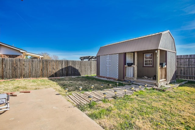 view of yard with an outbuilding and a patio