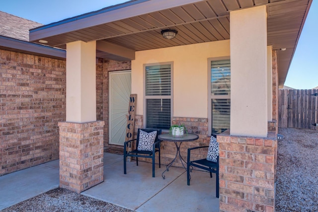 view of patio featuring fence
