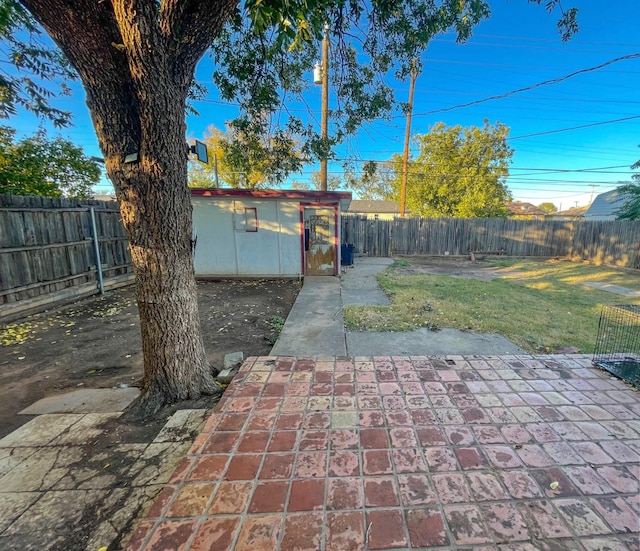 view of patio with an outbuilding