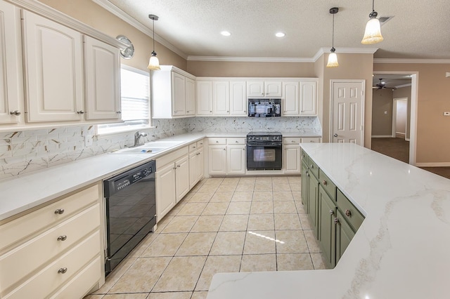 kitchen featuring hanging light fixtures, tasteful backsplash, white cabinetry, and black appliances