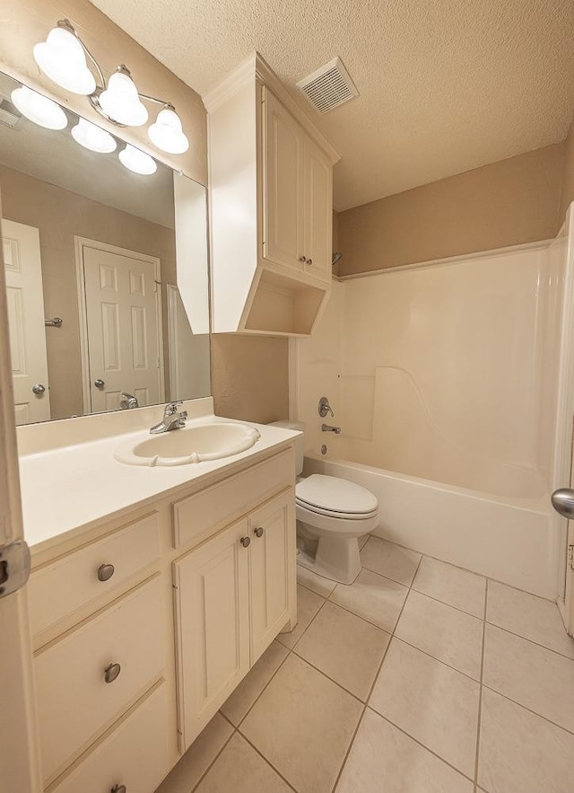 full bathroom with tile patterned flooring, vanity, a textured ceiling, bathtub / shower combination, and toilet