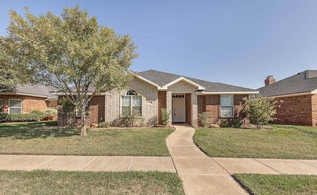 ranch-style home with a front lawn