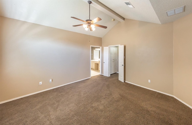 unfurnished bedroom featuring connected bathroom, dark colored carpet, high vaulted ceiling, ceiling fan, and beam ceiling