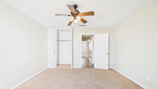 5768 38th St, Lubbock, TX 79407 - unfurnished bedroom with a textured ceiling, carpet floors, visible vents, and baseboards