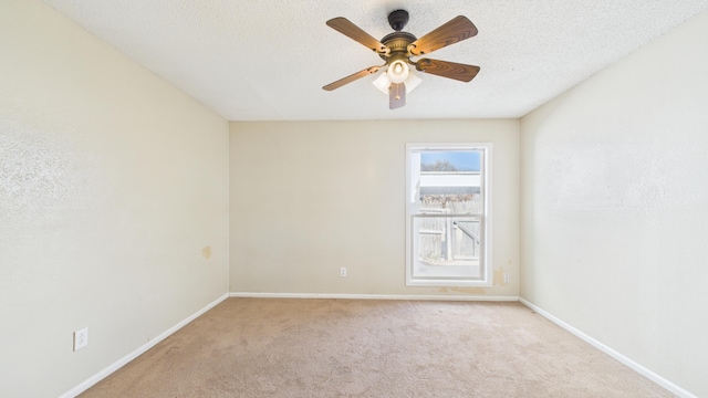 5768 38th St, Lubbock, TX 79407 - spare room featuring ceiling fan, baseboards, a textured ceiling, and light colored carpet