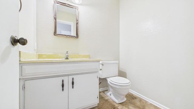 5768 38th St, Lubbock, TX 79407 - bathroom with toilet, vanity, and baseboards