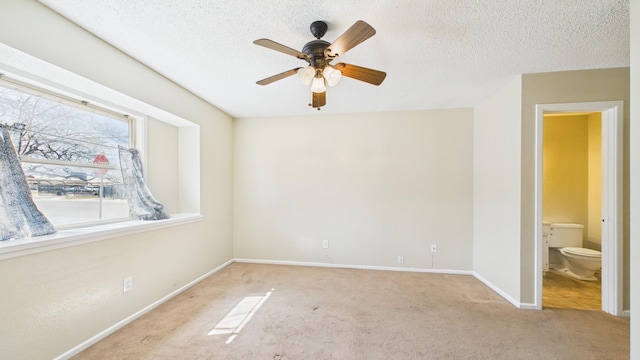 5768 38th St, Lubbock, TX 79407 - carpeted spare room featuring a textured ceiling, ceiling fan, and baseboards