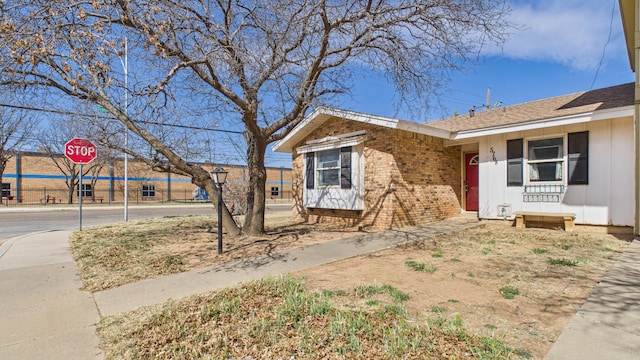 view of front of property featuring brick siding