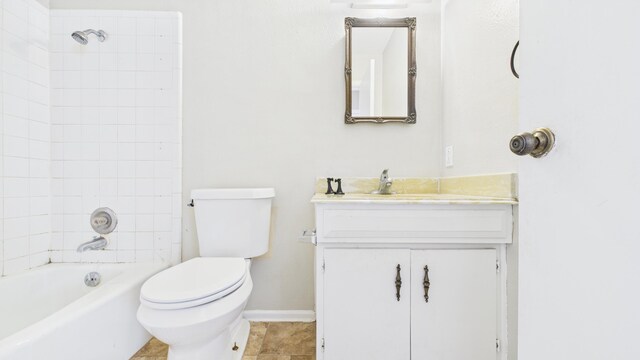 5768 38th St, Lubbock, TX 79407 - full bath with baseboards, toilet, tile patterned floors, vanity, and shower / bathing tub combination