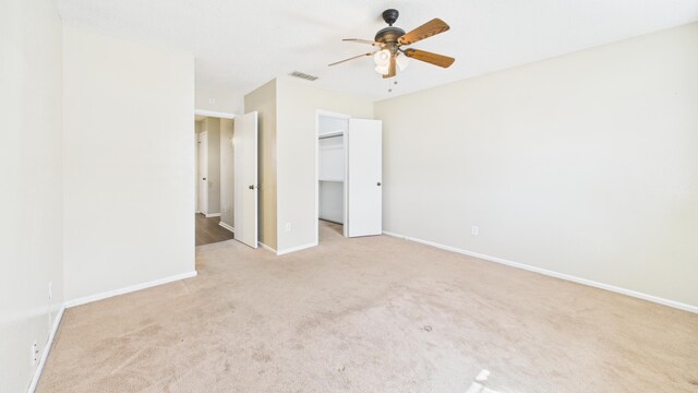 5768 38th St, Lubbock, TX 79407 - unfurnished bedroom with baseboards, visible vents, ceiling fan, a spacious closet, and carpet floors