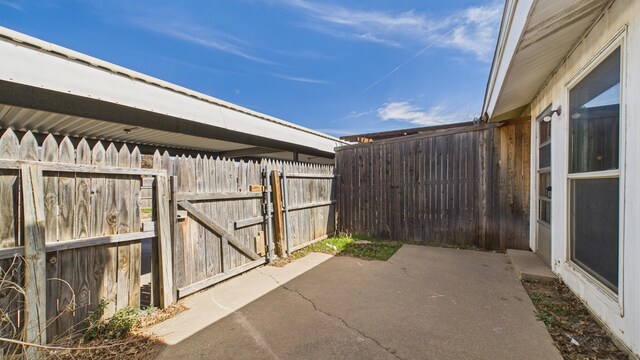 5768 38th St, Lubbock, TX 79407 - view of patio with a gate and fence