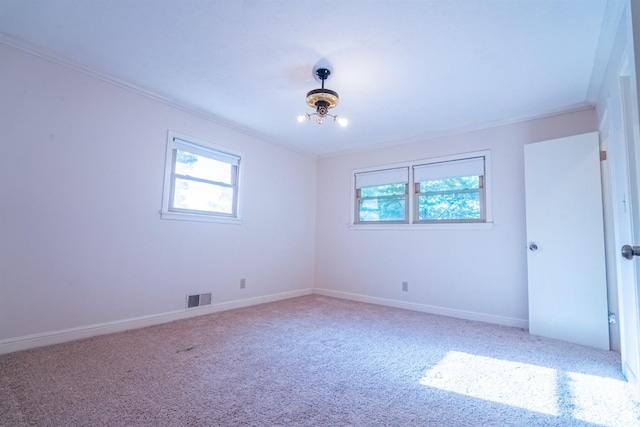 carpeted spare room with ornamental molding