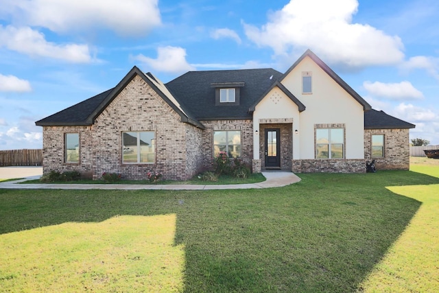 view of front of property with a front lawn