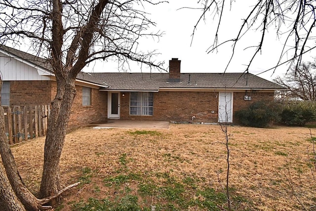 back of house with a yard and a patio area