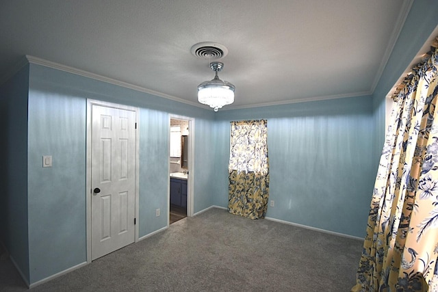 carpeted spare room with ornamental molding