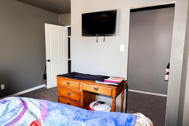 bedroom featuring dark colored carpet