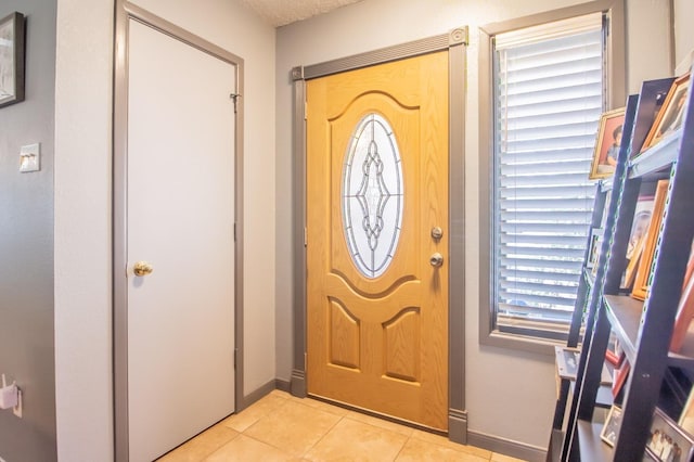 foyer with light tile patterned flooring