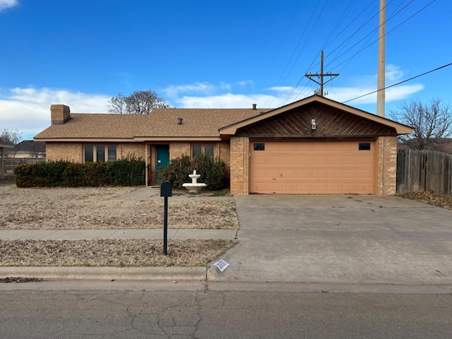 ranch-style home featuring a garage