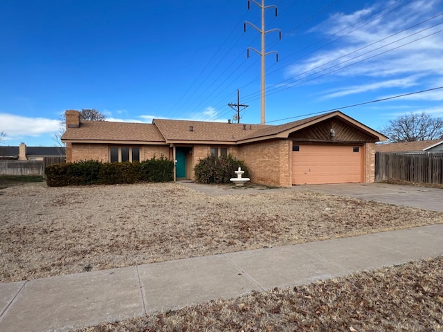 single story home with a garage